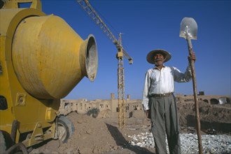 IRAN,   , Yazd, Construction worker on site Spade in hand