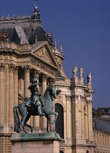 FRANCE, Ile de France, Versailles, Palace detail with bronze statue of man on horse