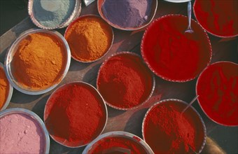 INDIA, Orissa, Puri, Dishes of colourful tika paint powder.