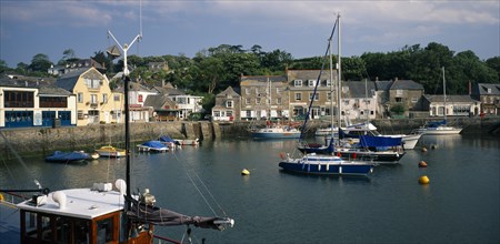 ENGLAND, Cornwall, Padstow , View across the harbour with fishing boats and yachts towards