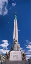 LATVIA, Riga, Freedom Monument. Green coloured copper statue on top of column