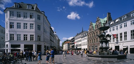 DENMARK, Zealand, Copenhagen , Stoget. People walking along street between traditional building