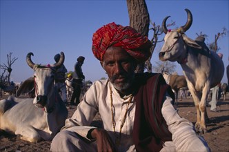 INDIA, Rajasthan, Nagaur, Portrait of man at cattle fair.