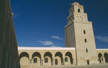 TUNISIA, Kairouan, Mosque and courtyard with minaret behind