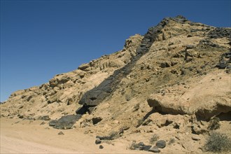 NAMIBIA, Dolerite Dyke, Molten laver ridge through hard rock with unequal weathering