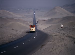 PERU, Transport, Traffic on Pan-American highway through coastal desert.