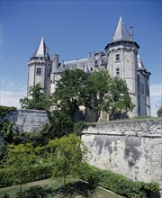 FRANCE, Loire Valley, Saumur Chateau, Looking over the garden with high walls up to the chateau
