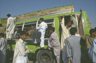 PAKISTAN, Punjab, Lahore  , Overcrowded bus