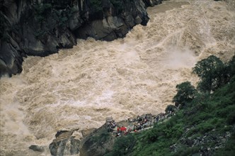 CHINA, Yunnan Province , Yangtze River, Swollen river water at Tiger Leaping Gorge.