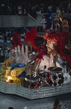 BRAZIL, Rio de Janeiro, Carnival float with large model of a fortune teller and crystal ball