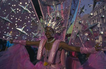 ENGLAND, London, Notting Hill Carnival, Dancer in pink and silver costume.