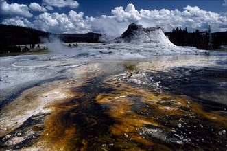 USA, Wyoming, Yellowstone National Park, Hot springs with ashen pool of acid dissolved mud and clay