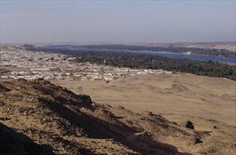 EGYPT, Nile Valley, Near Aswan , View form hillside over Nubian village on the bank of the Nile