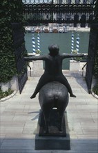 ITALY, Veneto, Venice, "Statue at the entrance to the Peggy Guggenheim museum, on the Grand Canal."