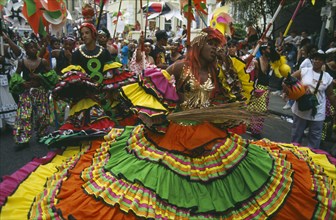 ENGLAND, London, Notting Hill Carnival, Dancers in costume during parade.