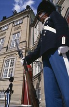 DENMARK, Copenhagen, Amalienborg Palace, Royal guards with bayonet rifels standing outside the