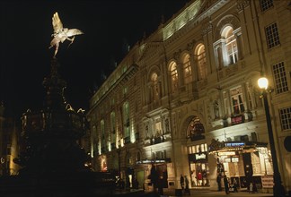 ENGLAND, London, Picadilly Circus at night with the Statue of Eros illuminated