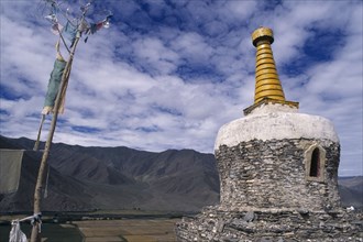 CHINA, Tibet, Yambu Lhakang Monastery, Chorten and prayer flags.