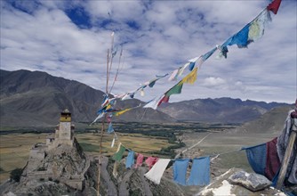 CHINA, Tibet, Religion, Yanbulagang Monastery with prayer flags flying in the foreground