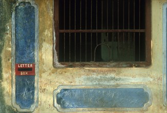 SRI LANKA, Near Jaffna, Detail of colourful but weathered post office window