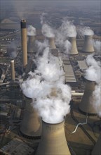 ENGLAND, North Yorkshire, Drax, Aerial view over cluster of Power Station chimneys releasing white