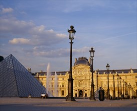 FRANCE, Ile de France, Paris, "Louvre,  Cour Napoleon and glass pyramid in evening light with