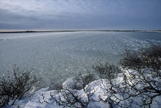 CANADA, Landscape, Frozen lake on the Canadian Tundra. Ice balls are formed as the water slowly
