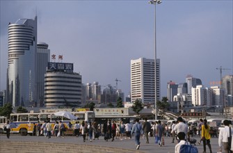 CHINA, Guangdong, Shenzhen, "Special Economic Zone, city buildings, buses and crowds of pedestrians