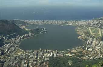 BRAZIL, Rio de Janeiro, Aerial view over Lake Rodrego de Freitas and surrounding area with the sea