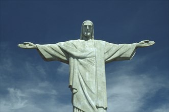 BRAZIL, Rio de Janeiro, Cocovado Statue of Christ the Redeemer with outstretched arms against