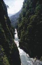 TAIWAN, Near Tien-hsiang, Deep gorge with fast flowing river at the bottom of the steep cliffs