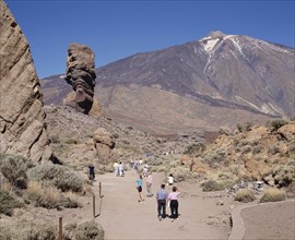 SPAIN, Canary Islands, Tenerife, Mount Teide National Park with tourists on dry and dusty path
