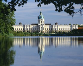 GERMANY, Berlin, Charlottenburg Palace and reflection in lake in the foreground.  Part framed by