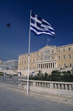 GREECE, Athens , Parliament Building and Greek Flag in the foreground