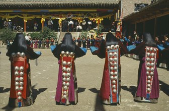 CHINA, Guizhou, Tongren , Tibetan Festival. Girls dancing at Monastery