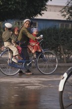 CHINA, Xinjiang, Kashgar, Family on a bicycle