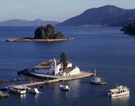 GREECE, Ionian Islands, Corfu, "Mouse Island, view over white church on an island in a lake"