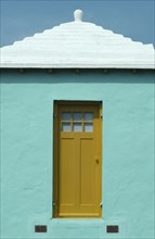 BERMUDA, Architecture, White rooved turquoise house with yellow door missing staircase