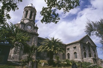 WEST INDIES, Antigua, St John’s, "Cathedral, exterior with clock tower and grave stones part framed