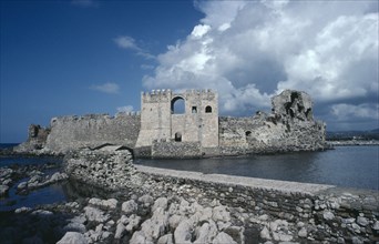 GREECE, Peloponnese, Methoni, Ruins of stone fort and crenellated walls.