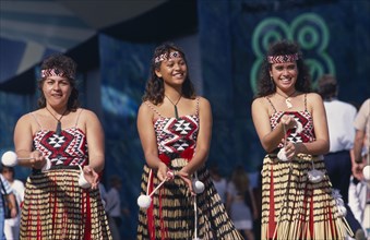 NEW ZEALAND, People, Maori , Maori girls doing Poi dance wearing grass skirts