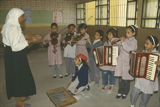 EGYPT, Cairo, Childrens music lesson in state school