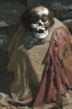 PERU, Ica Administrative Division, Nazca, Mummified body in a Nazca cemetery.