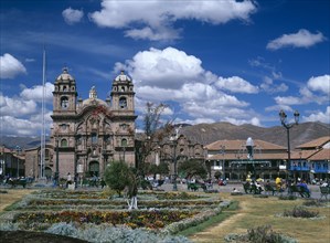 PERU, Cusco Department, Cusco, "Plaza de Armas.  View across colourful, formal garden towards La