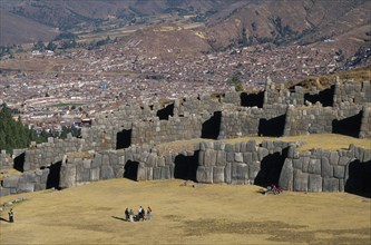 PERU, Cusco Department, Sacsayhuamán, Looking down on visitors walking between the Inca walls and