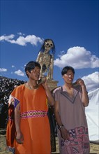 PERU, Cusco Department, Cusco, Young men carrying an ancestor mummy during Inti Raymi.