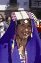 PERU, Cusco Department, Cusco, Young woman in traditional costume at Inti Raymi.  Head and