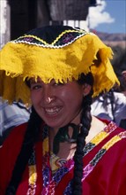 PERU, Cusco, Young woman in traditional costume at Inti Raymi.  Head and shoulders shot.    Cuzco