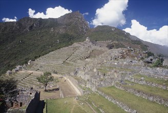 PERU, Cusco Department, Machu  Picchu, View across the ruins towards surrounding mountains.