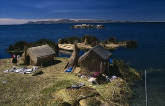 PERU, Puno Administrative Department, Puno, Lake Titicaca.  Reed houses on floating islands built